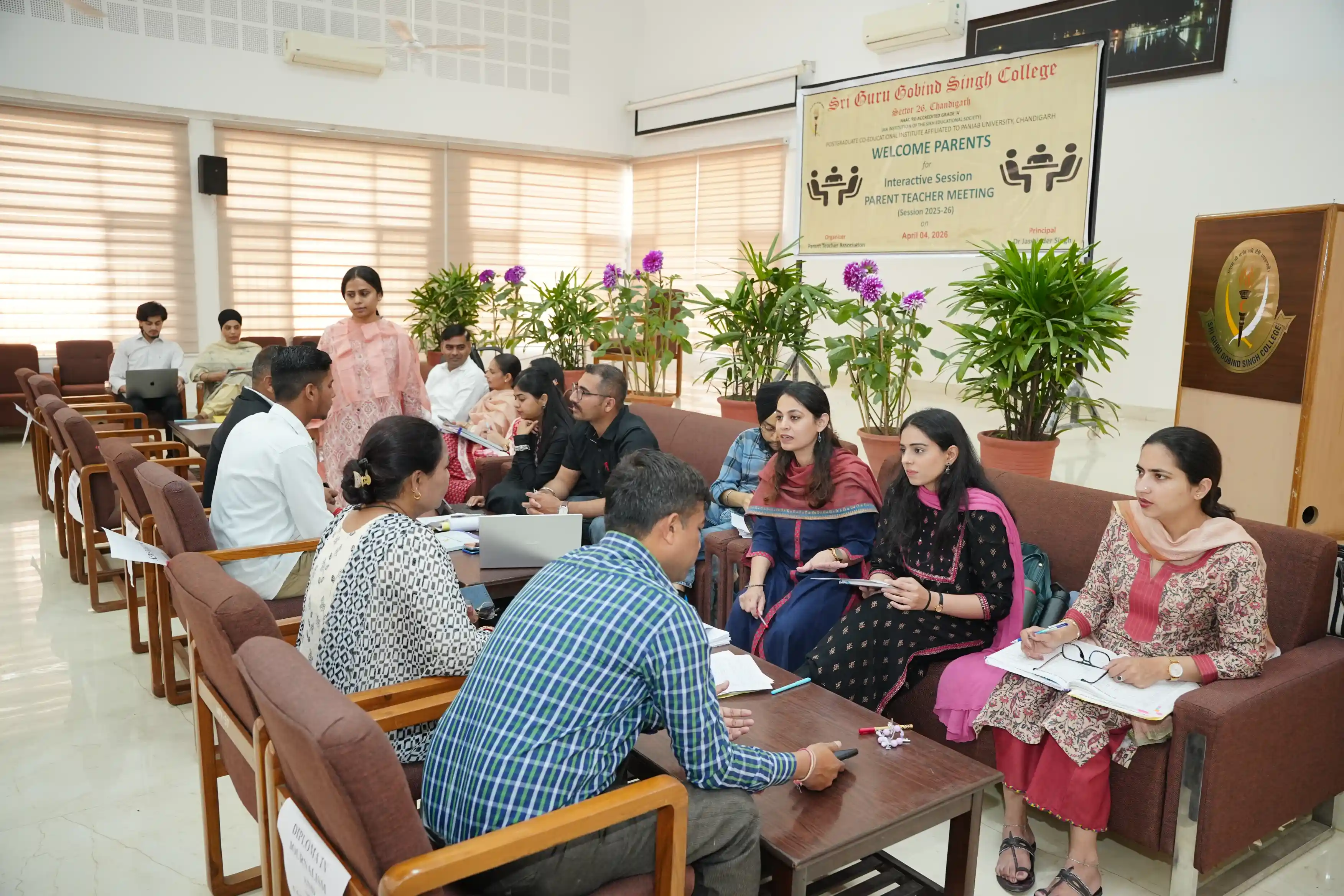 Parents interacting with faculty members